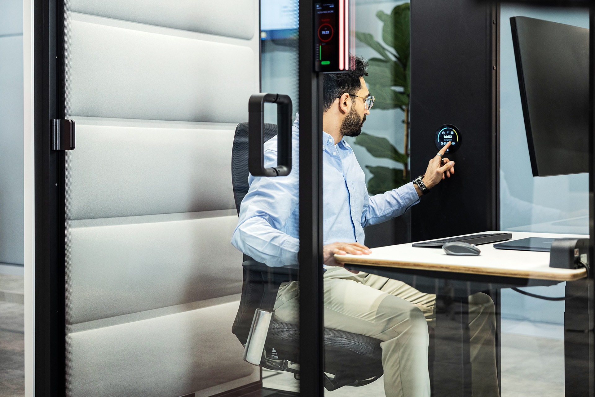 Hushfree Work booth in an open-plan office with a person working inside