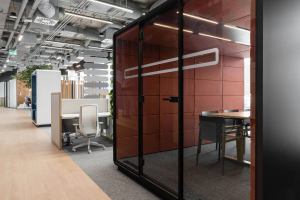 Maroon Hushmeet pod with a table and chairs inside