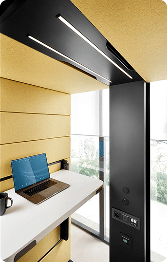 The interior of acoustic office workpod for focused work in standing and sitting position hushWork.sit&stand Hushoffice