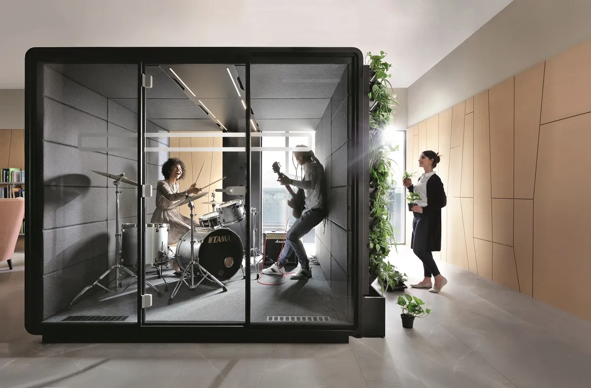 HushMeet.L is like a prefab soundproof room — spacious so tenants can furnish it themselves.